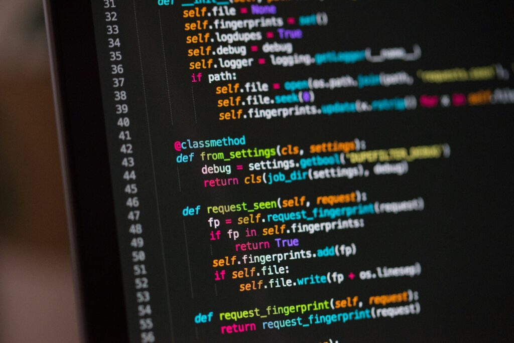 Lines of colorful programming code displayed on a dark computer screen