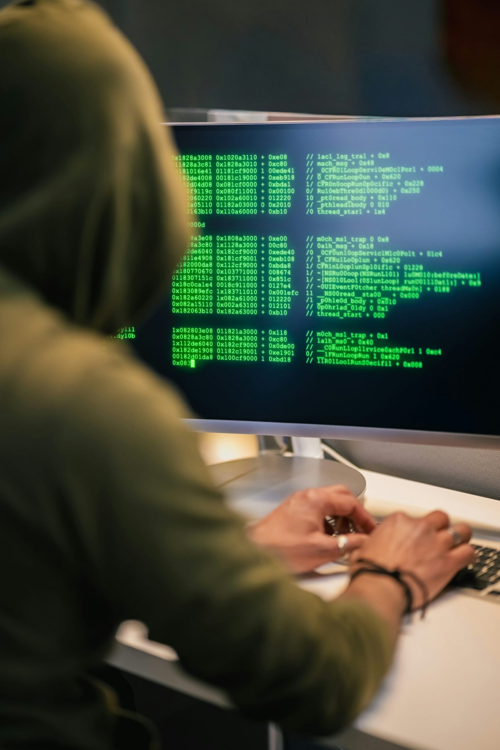 Developer reviewing code on a computer during a software security assessment